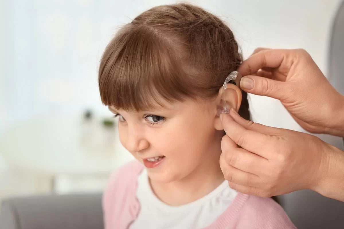 child-receiving-smart-hearing-aid-1200x800-1